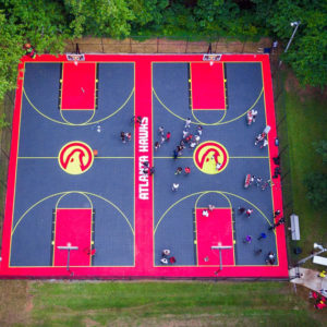 commercial outdoor basketball court flooring with Atlanta Hawks theme built by CBA Sports