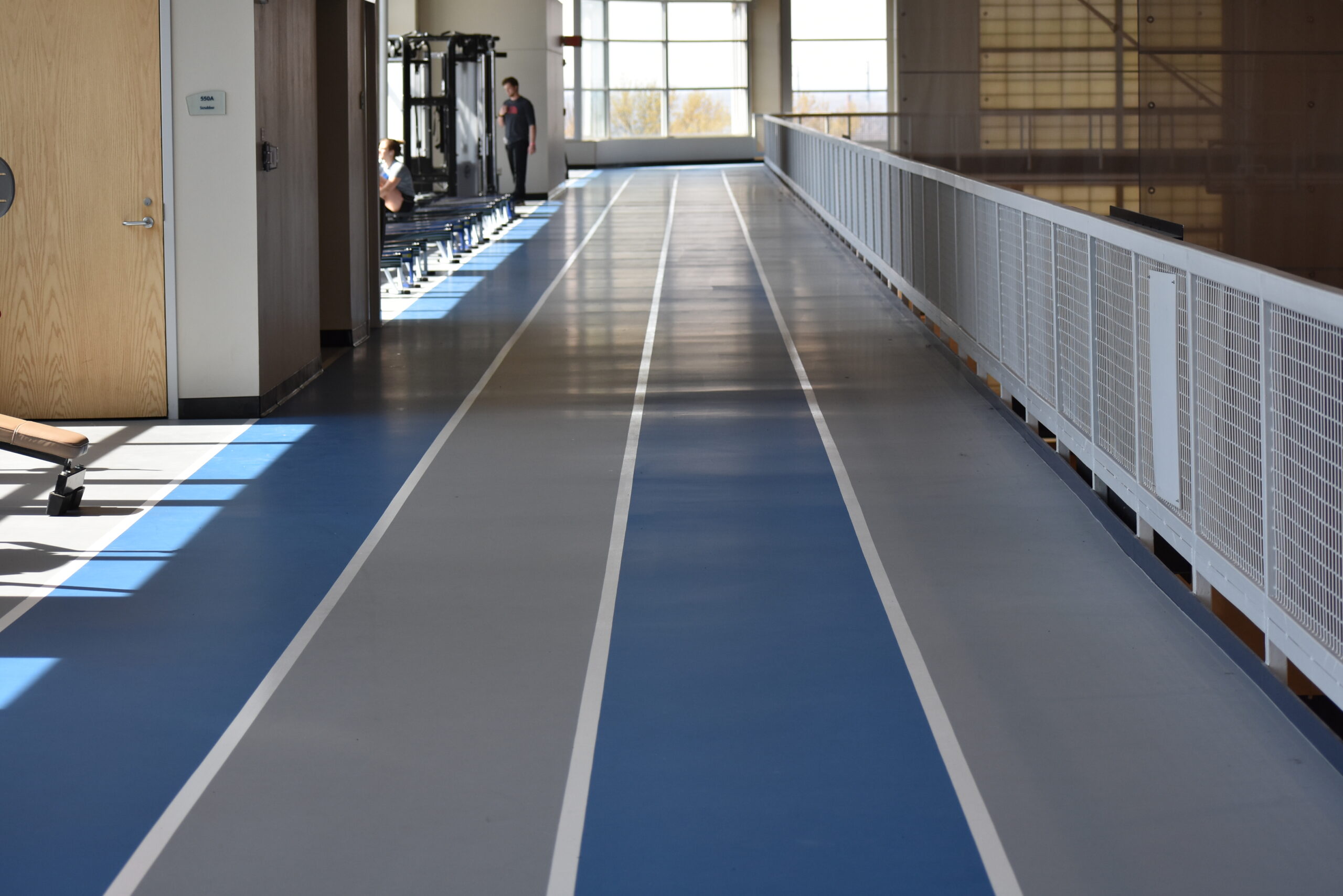 Indoor running track floor on the top floor of a gymnasium.
