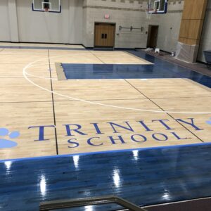 Trinity school basketball court flooring.