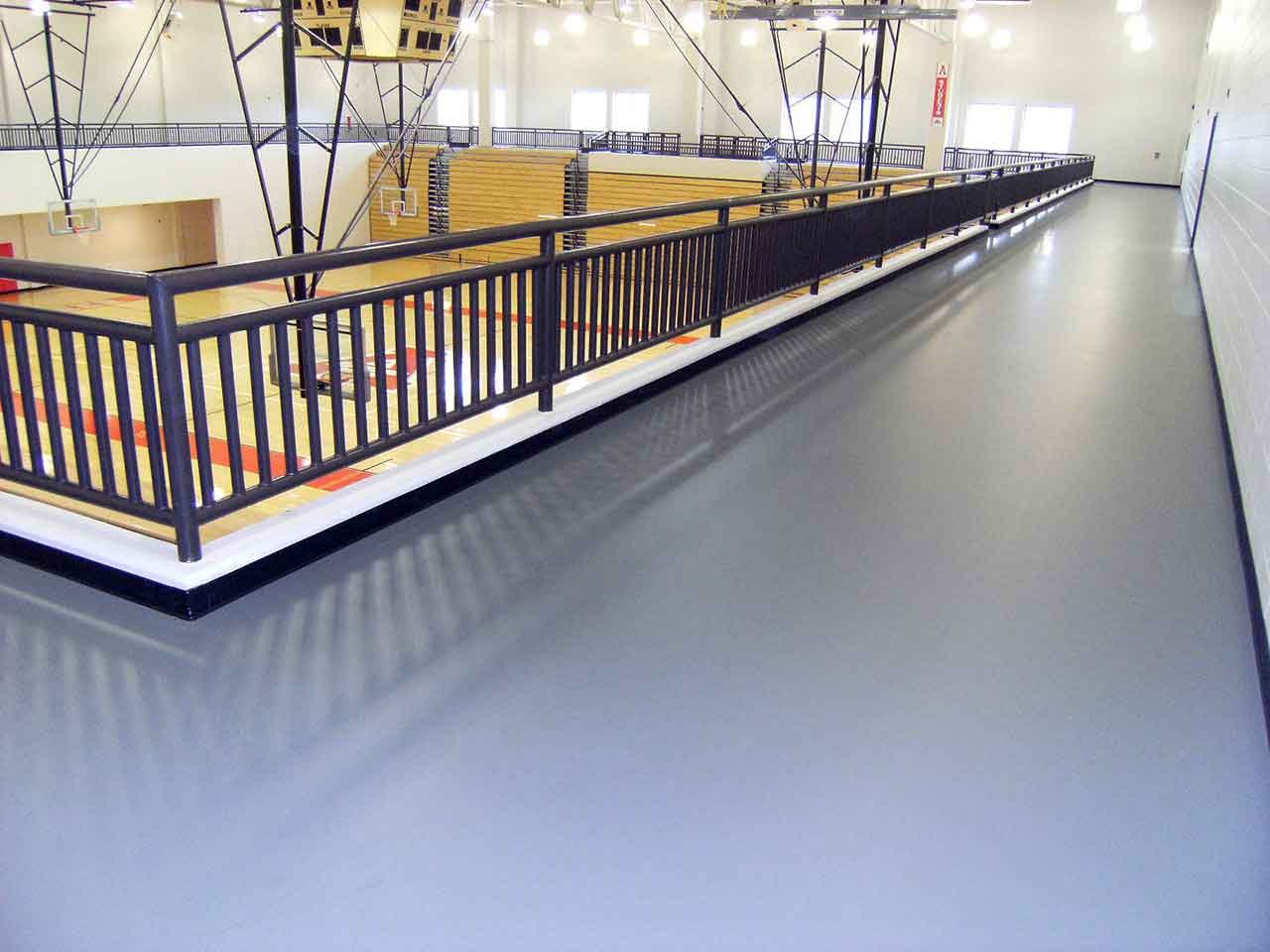 gray indoor floor track in a university rec center