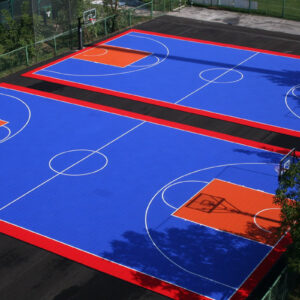 Two outdoor commercial basketball courts with aerial view.