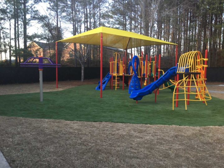 playground turf installed next to carpet for a commercial playground
